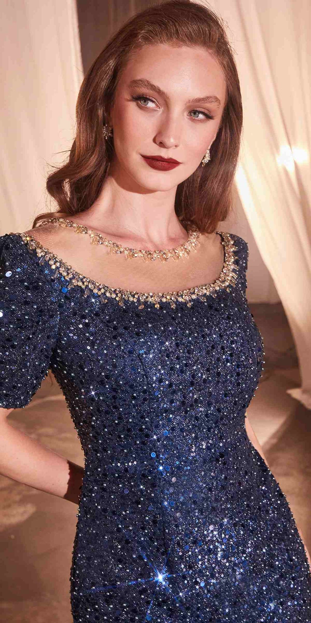 Dark blue sequin fitted gown with short sleeves and sparkling bateau neckline