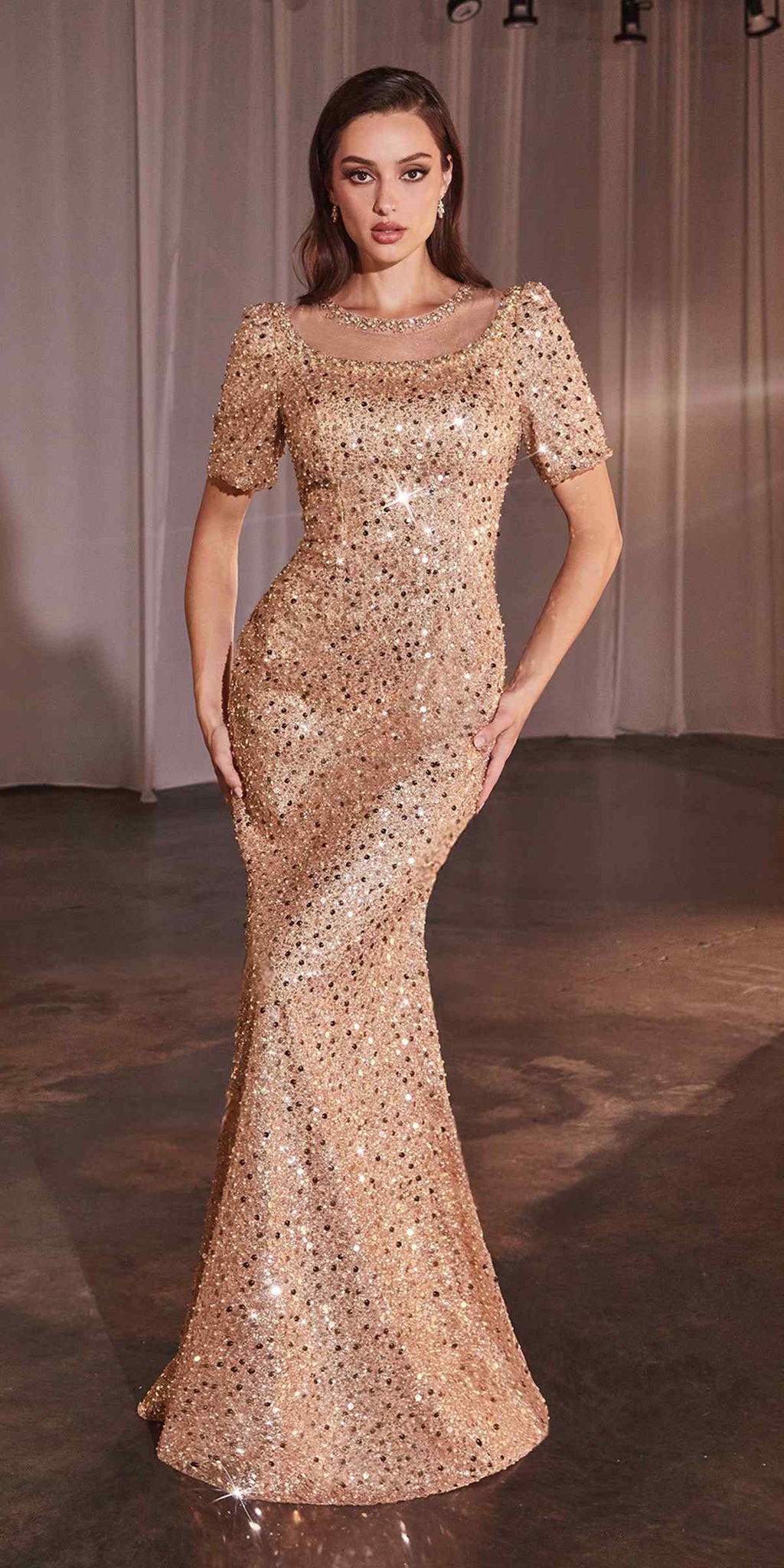Rose gold sequin fitted long-sleeve gown with bateau neckline and scalloped cuffs