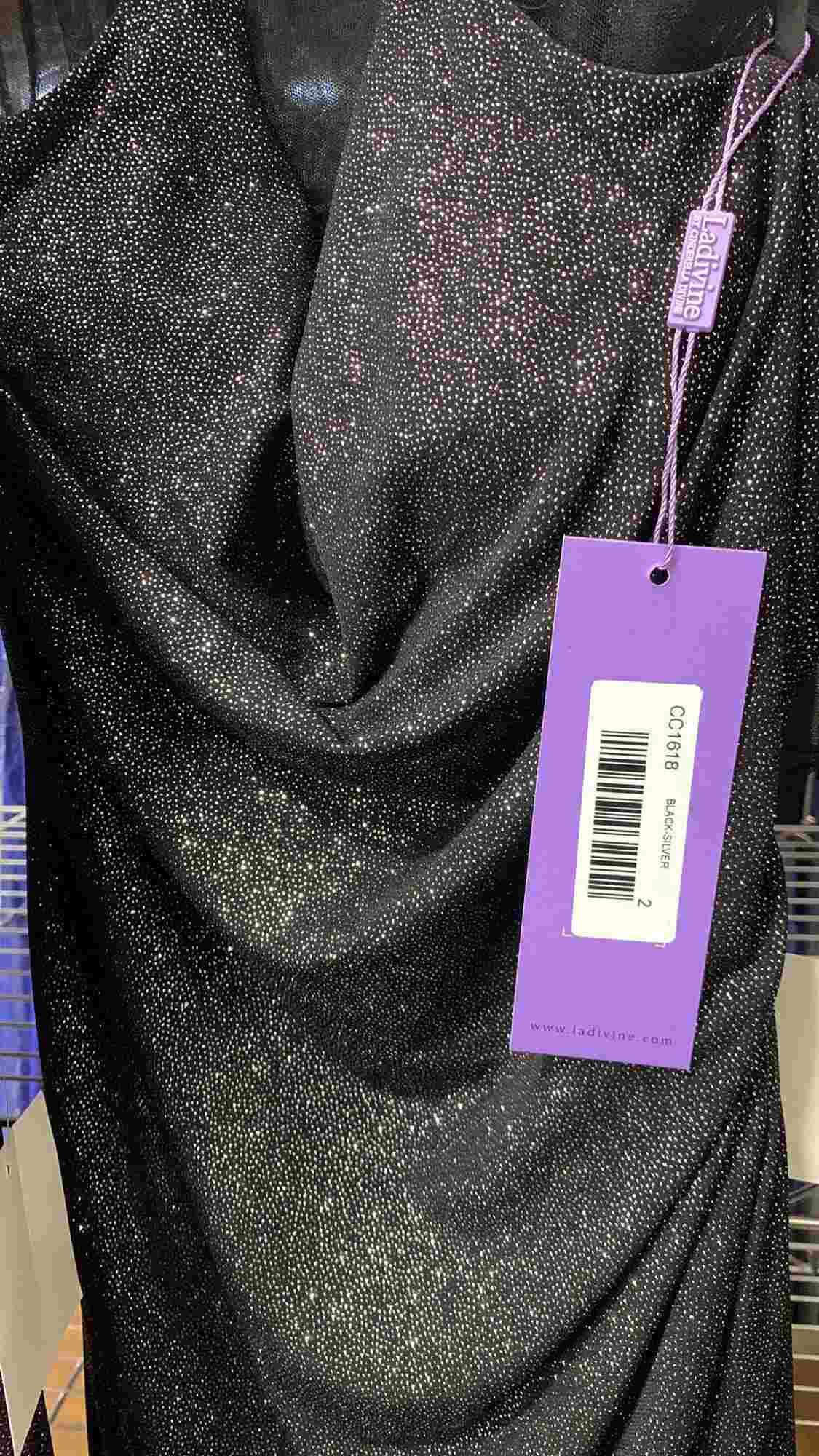 Black glitter gown fabric with attached size tag