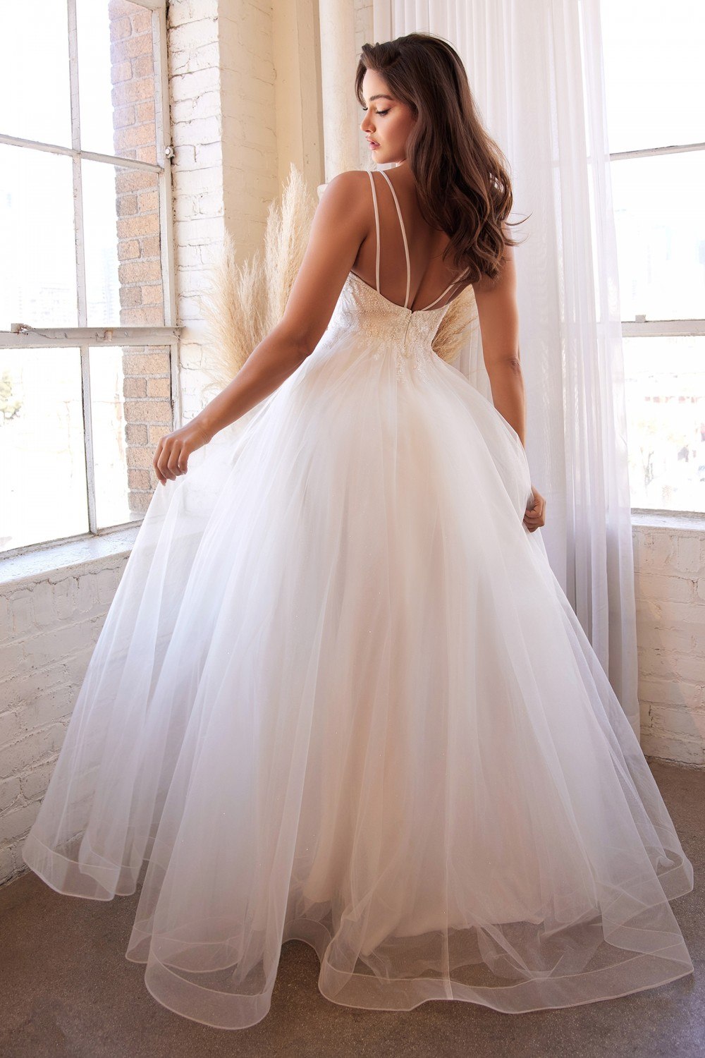 Off-white tulle long dress with open back, layered skirt, and beaded bodice details