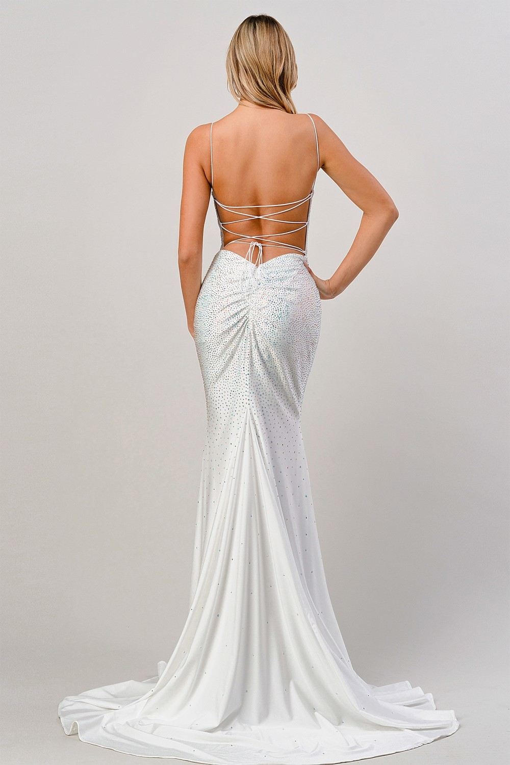 Long fitted formal dress back view in light blue with rhinestone sparkle and open ties
