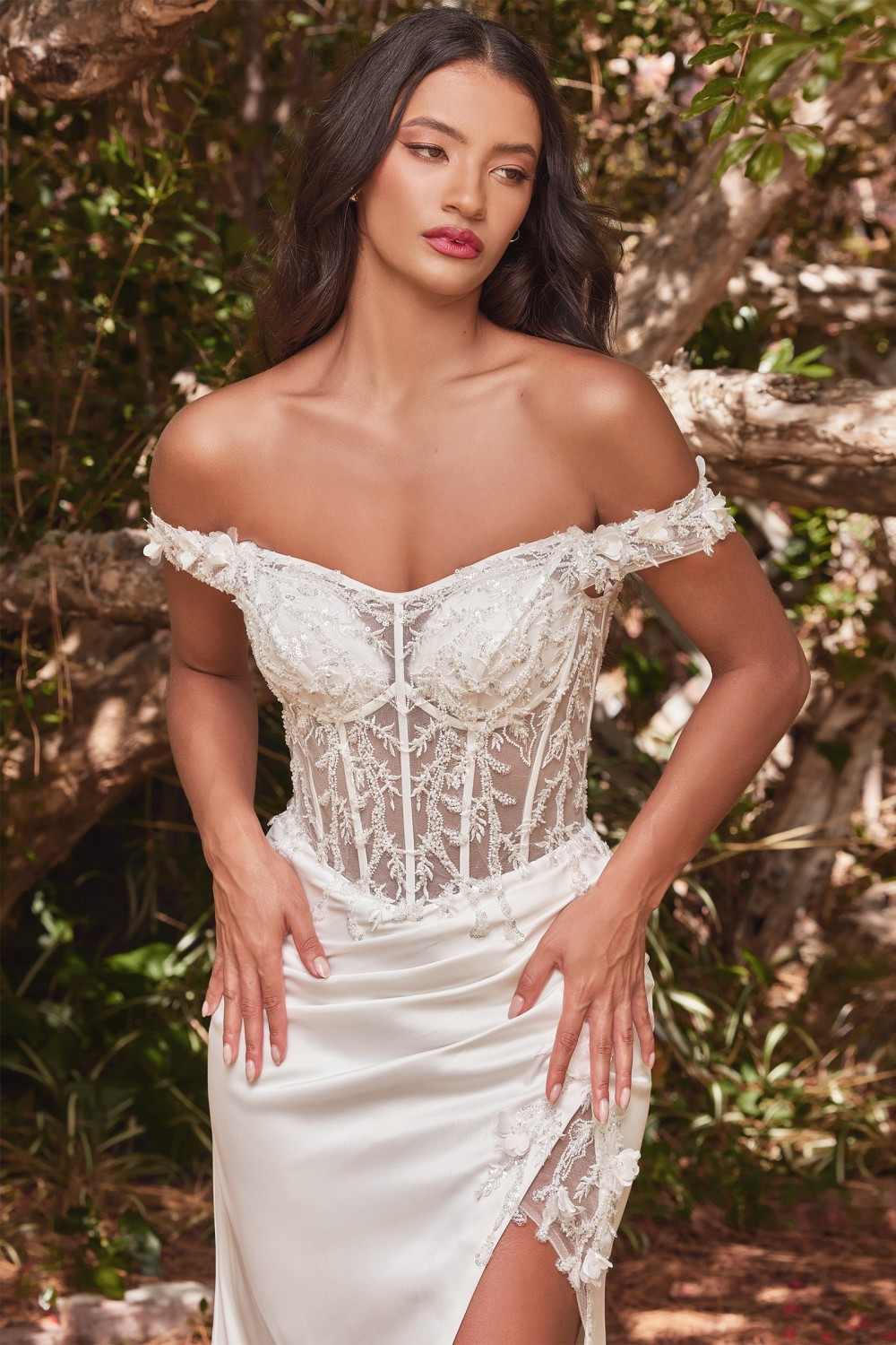 Off-shoulder corset gown with floral lace bodice and off-white skirt with slit