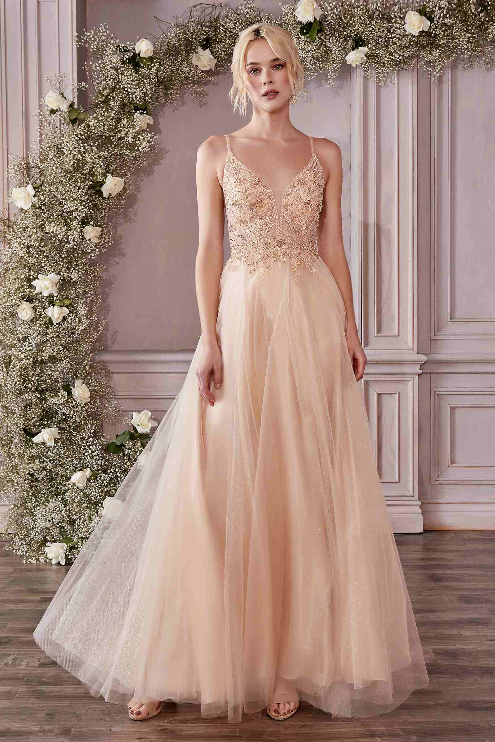 Champagne A-line tulle gown with beaded corset bodice and thin spaghetti straps