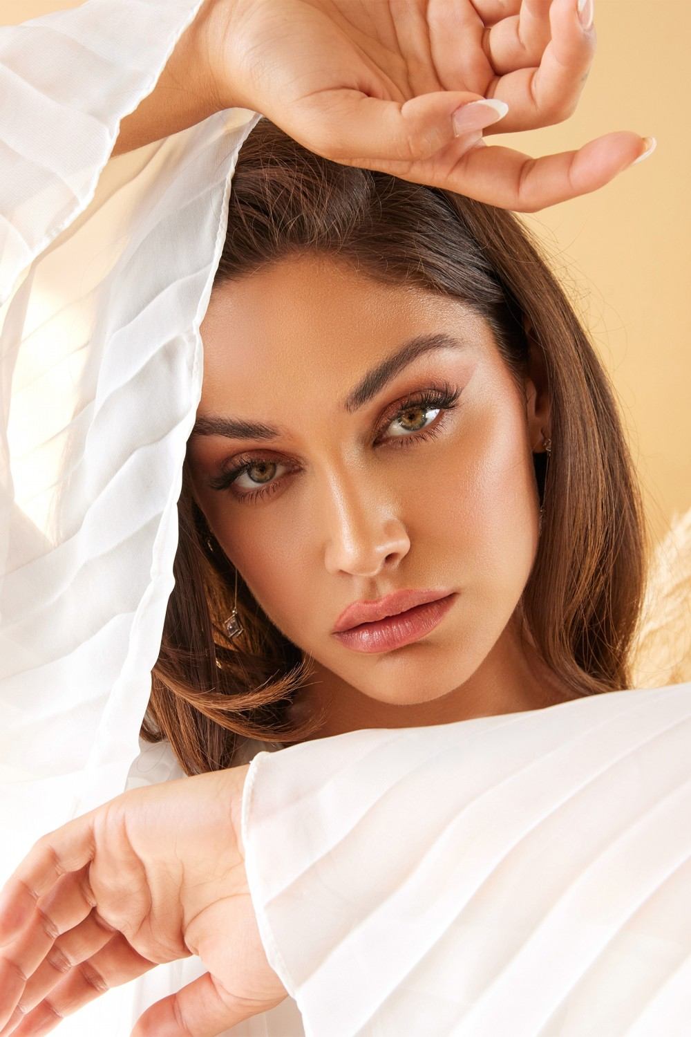 Off-white chiffon gown neckline close-up with V-neck and sheer long sleeves