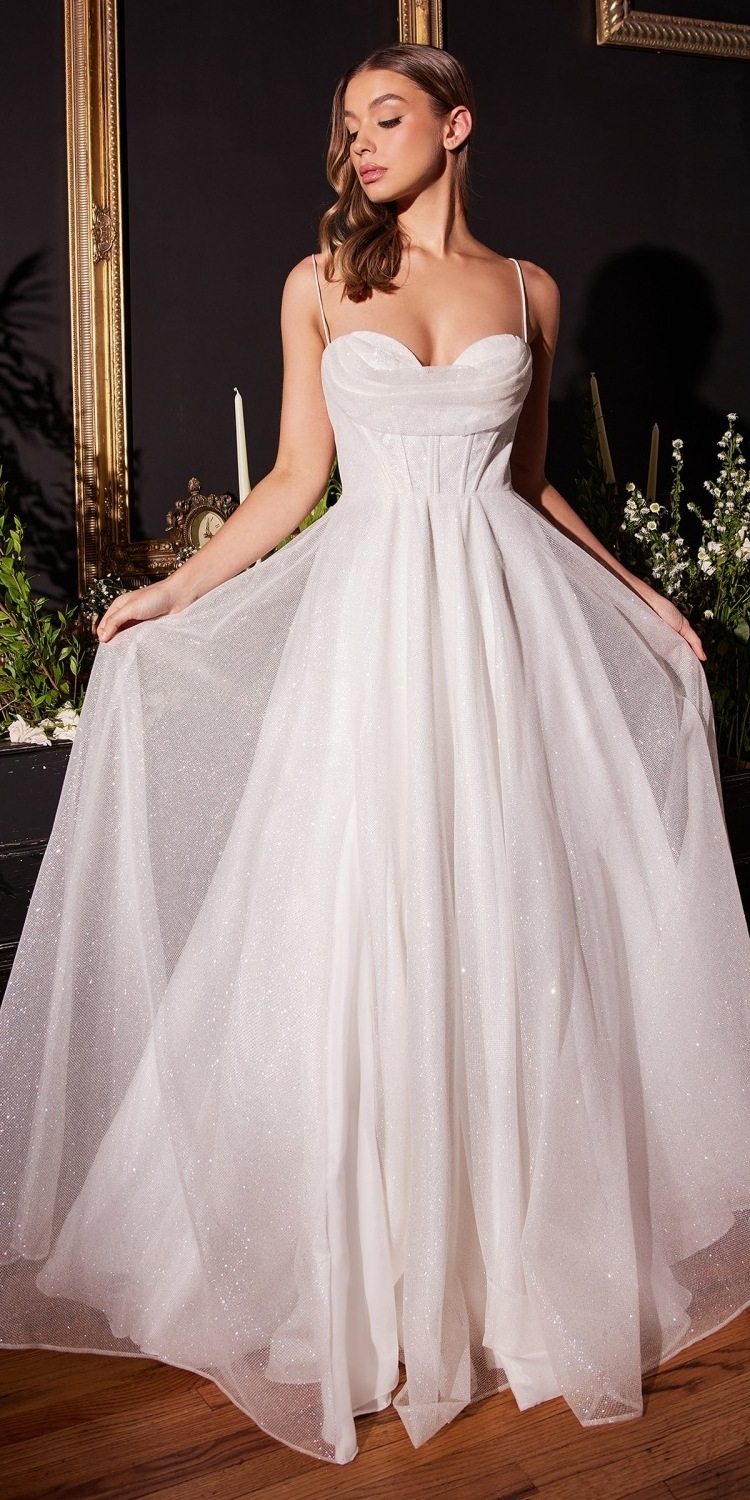 Off-white glitter bridal gown with sweetheart neckline, long tulle skirt, side slit