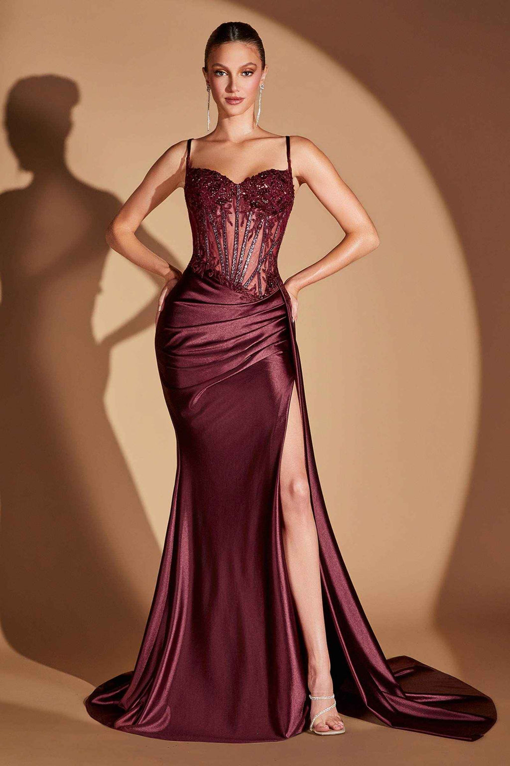 Burgundy formal gown with lace corset bodice, spaghetti straps, and side slit