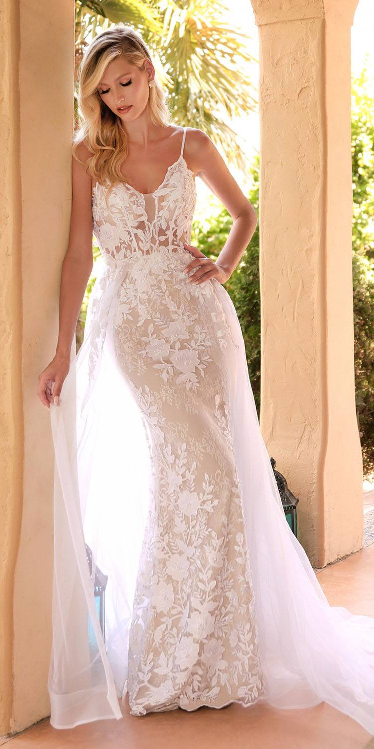 Off-white lace wedding gown with sheer overlay, sleeveless V-neck, A-line skirt