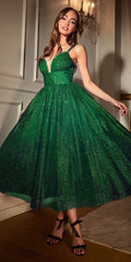 Emerald green glitter flocked tea-length dress with V neckline and flared skirt