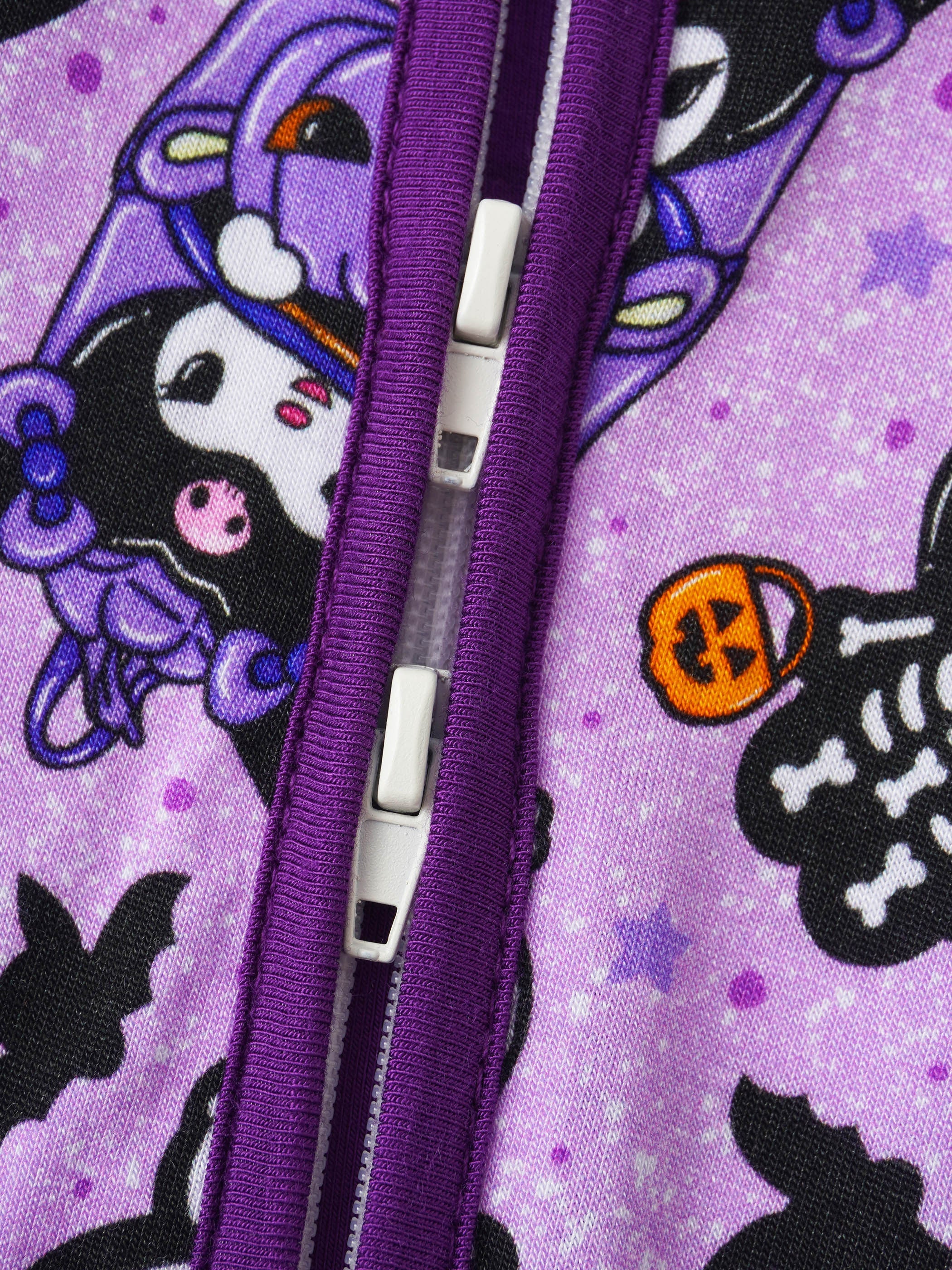 Purple zipper placket on printed baby romper with cartoon cat faces