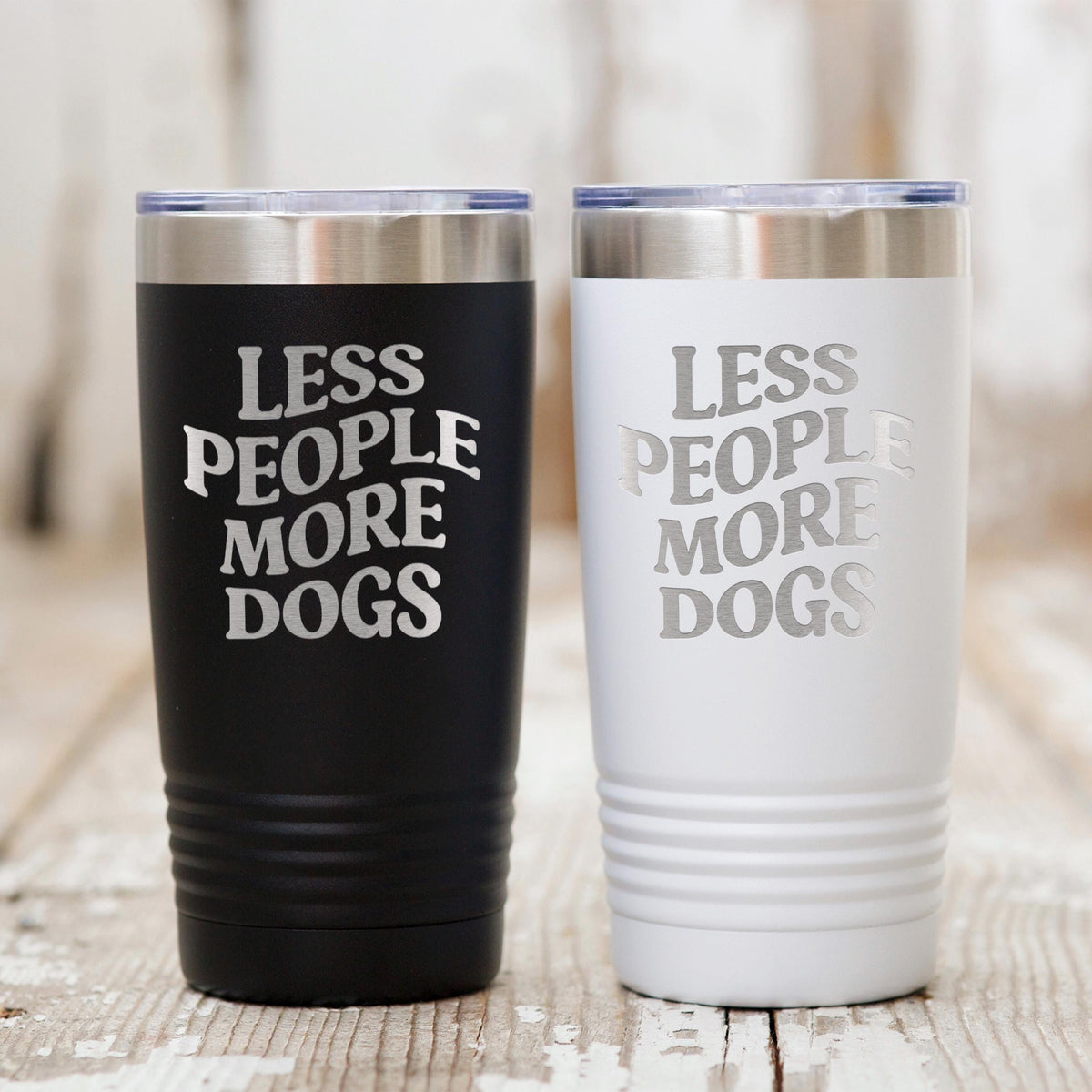 Pair of stainless steel tumblers: black and white, each with “LESS PEOPLE MORE DOGS.”