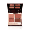 Makeup palette with four rose and brown shades in open compact