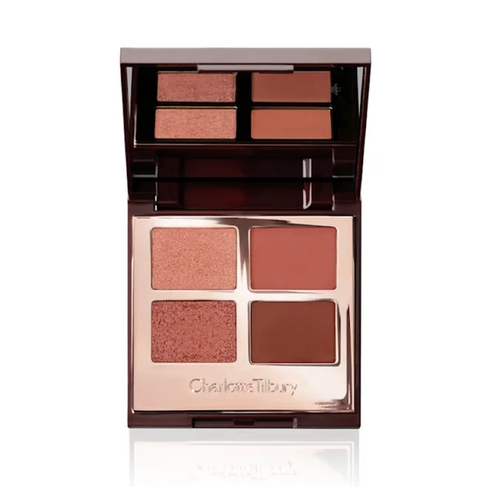 Makeup palette with four rose and brown shades in open compact
