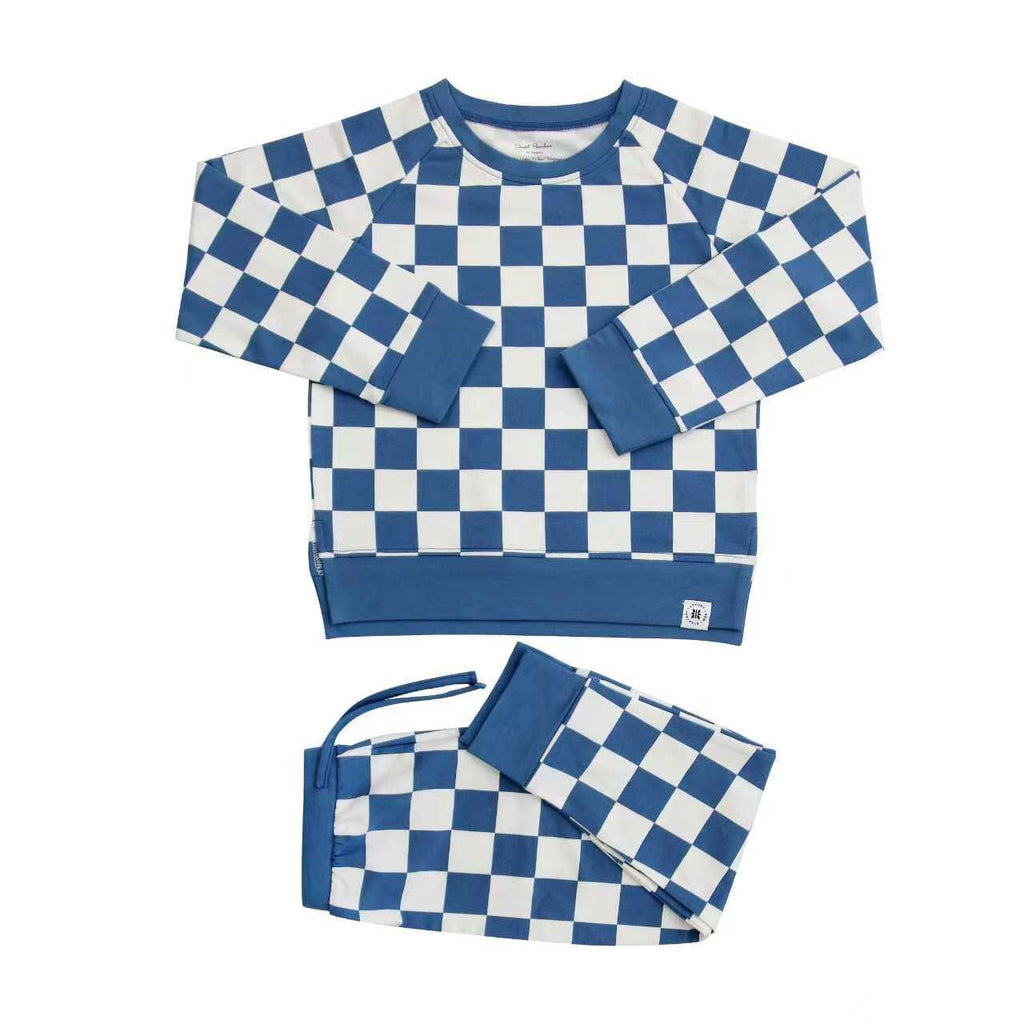 Blue and white checkered crew neck top and jogger pants set, flat lay.