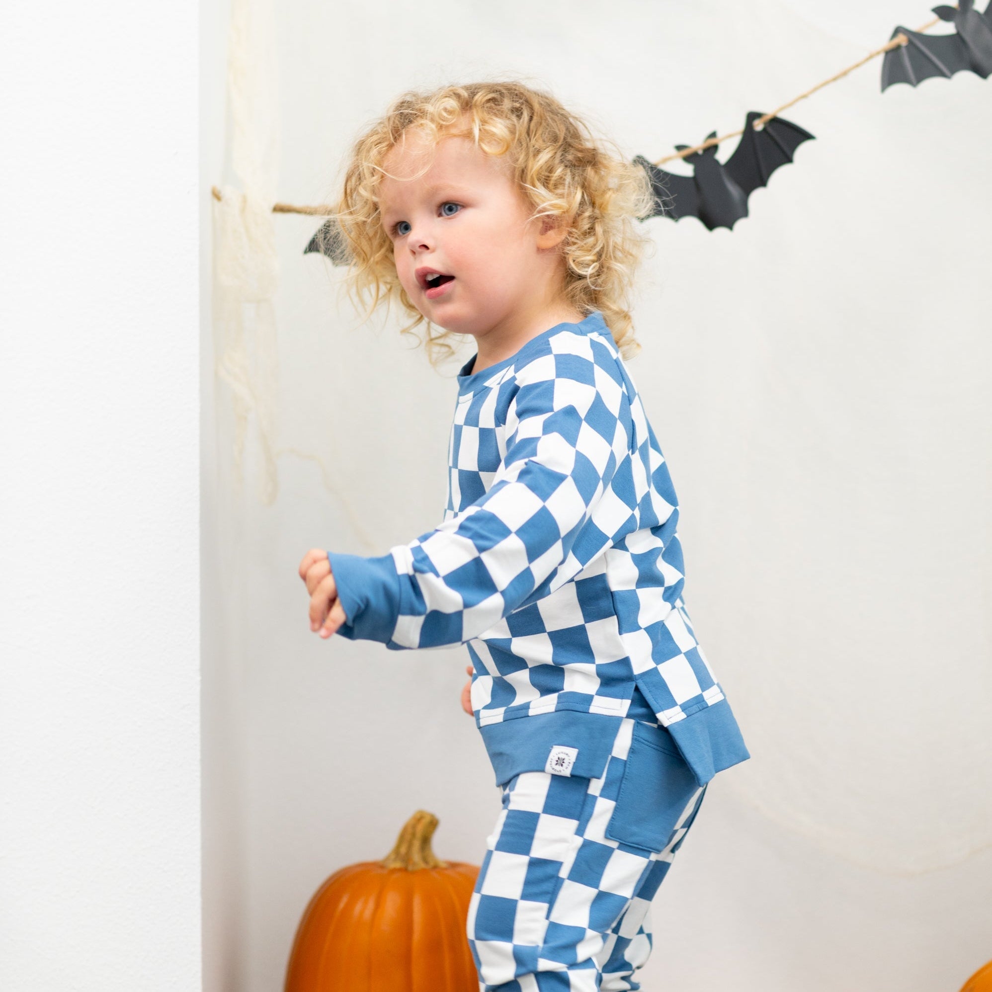 Blue and white checkered crew neck jogger set with matching pants, full outfit.