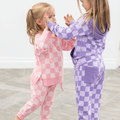 Purple checker crew neck sweatshirt and jogger pants set, long sleeves, drawstring waist.