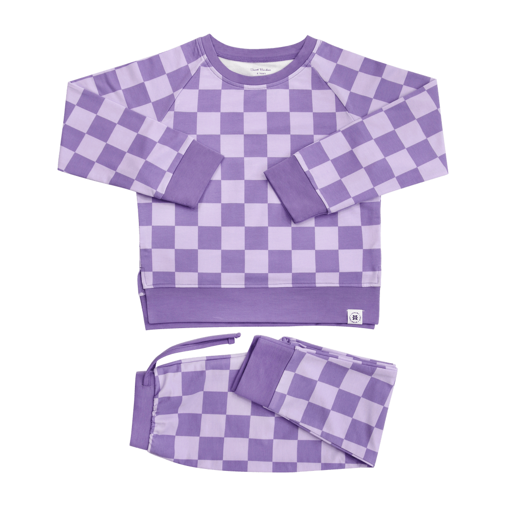 Purple checker crew neck sweatshirt and matching jogger pants set, flat lay.