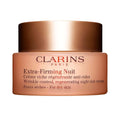 Clarins extra-firming night cream jar with brown lid and label, for dry skin