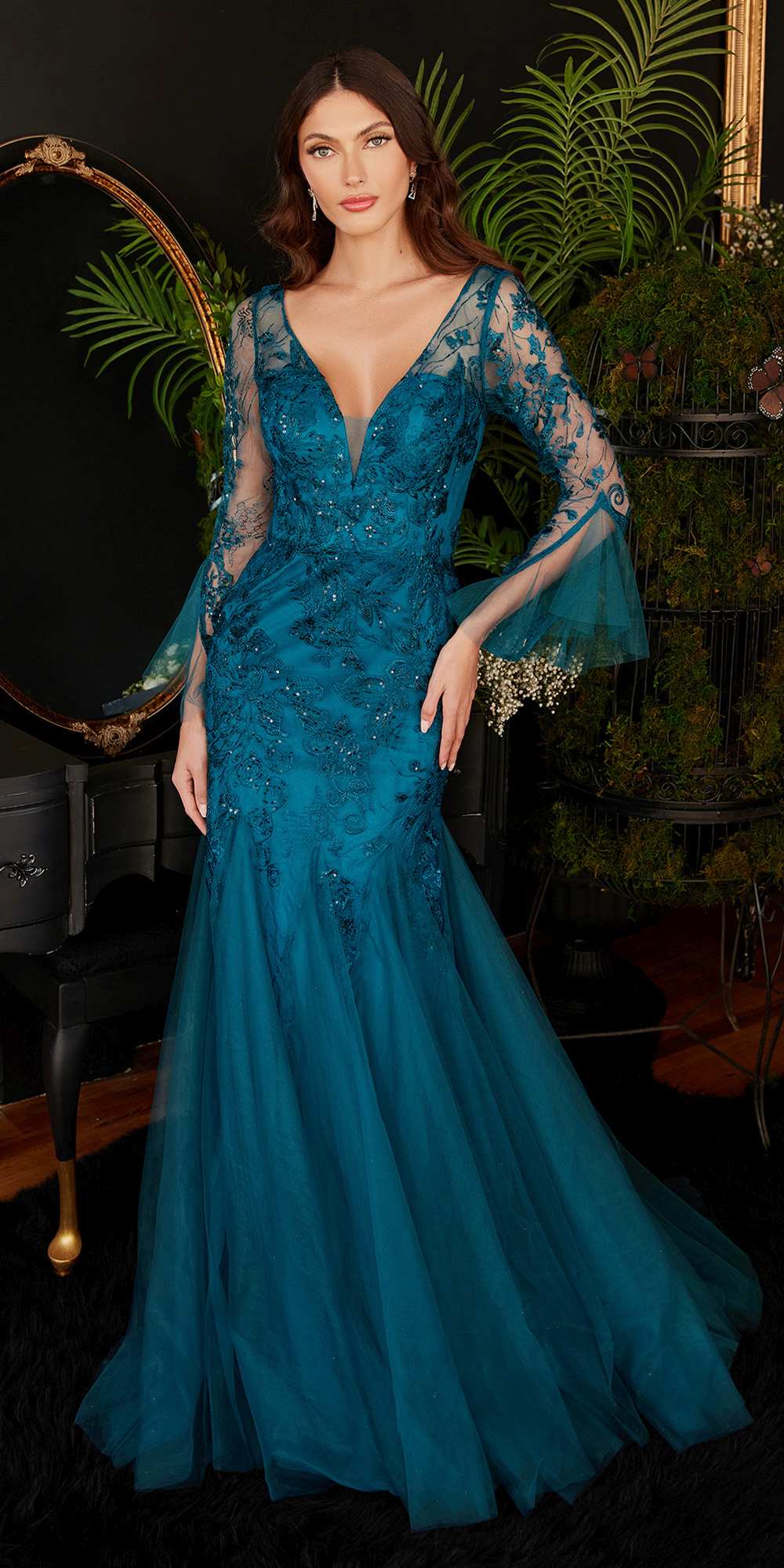 Peacock-blue mermaid gown with V-neck, lace-like texture, and bell sleeves