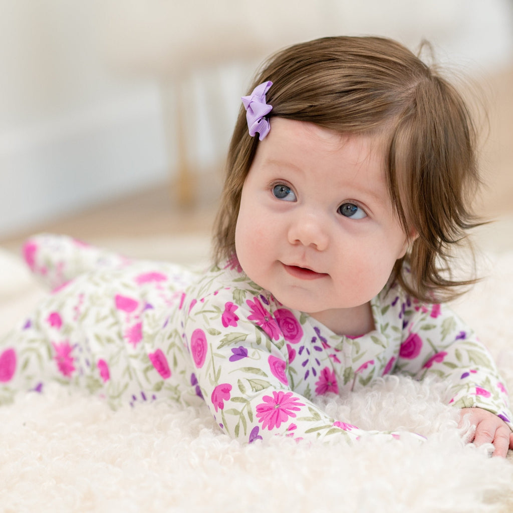 Baby girl floral long-sleeve romper in white with pink and purple flowers