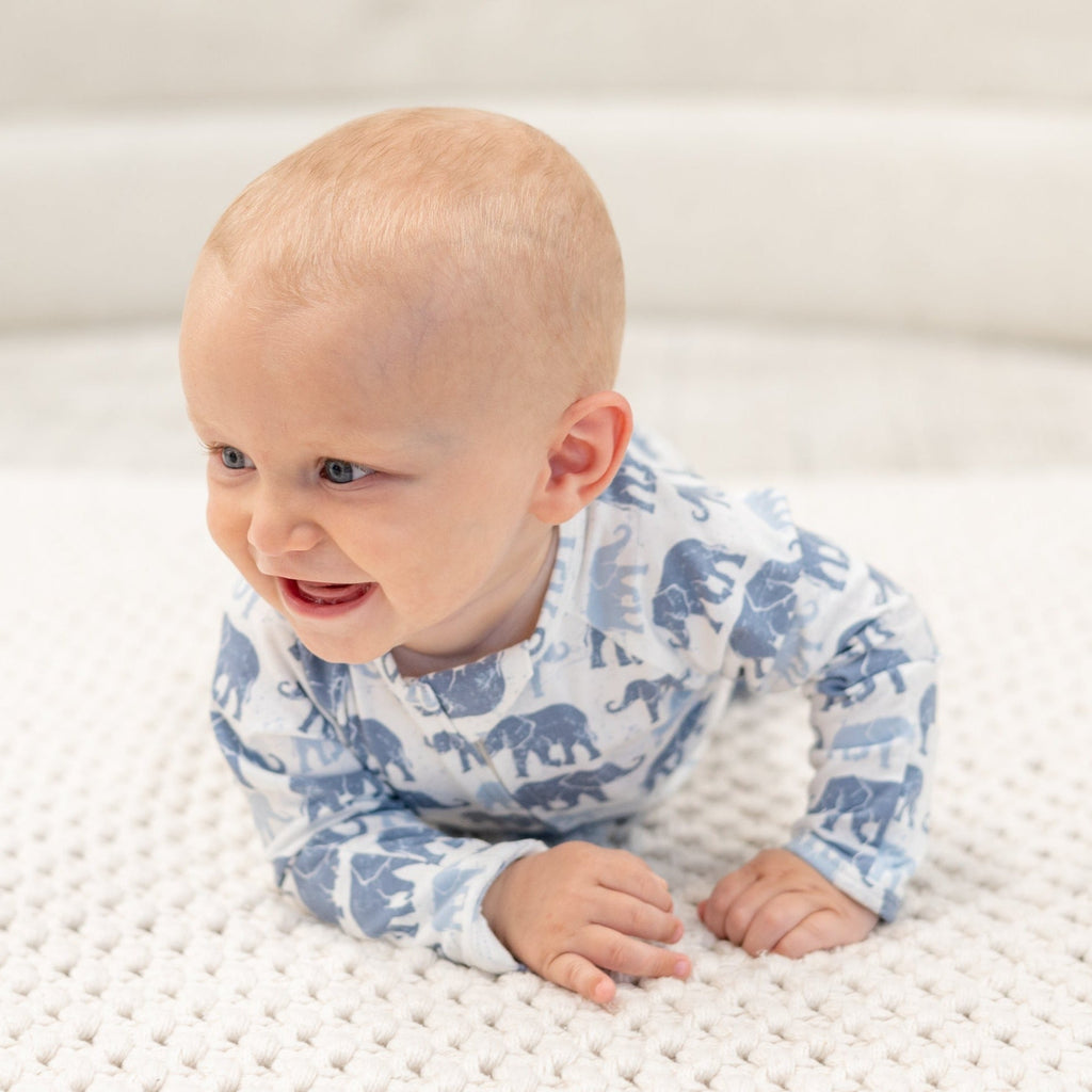 Elephant-print baby romper in light blue, long sleeves and enclosed leg cuffs