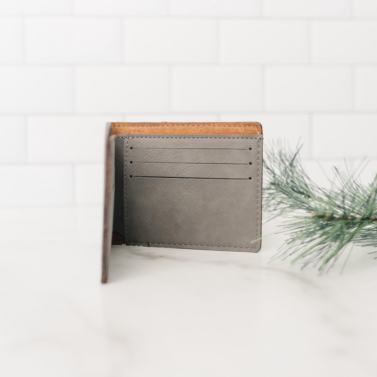Brown leather bifold wallet open view showing card slots inside