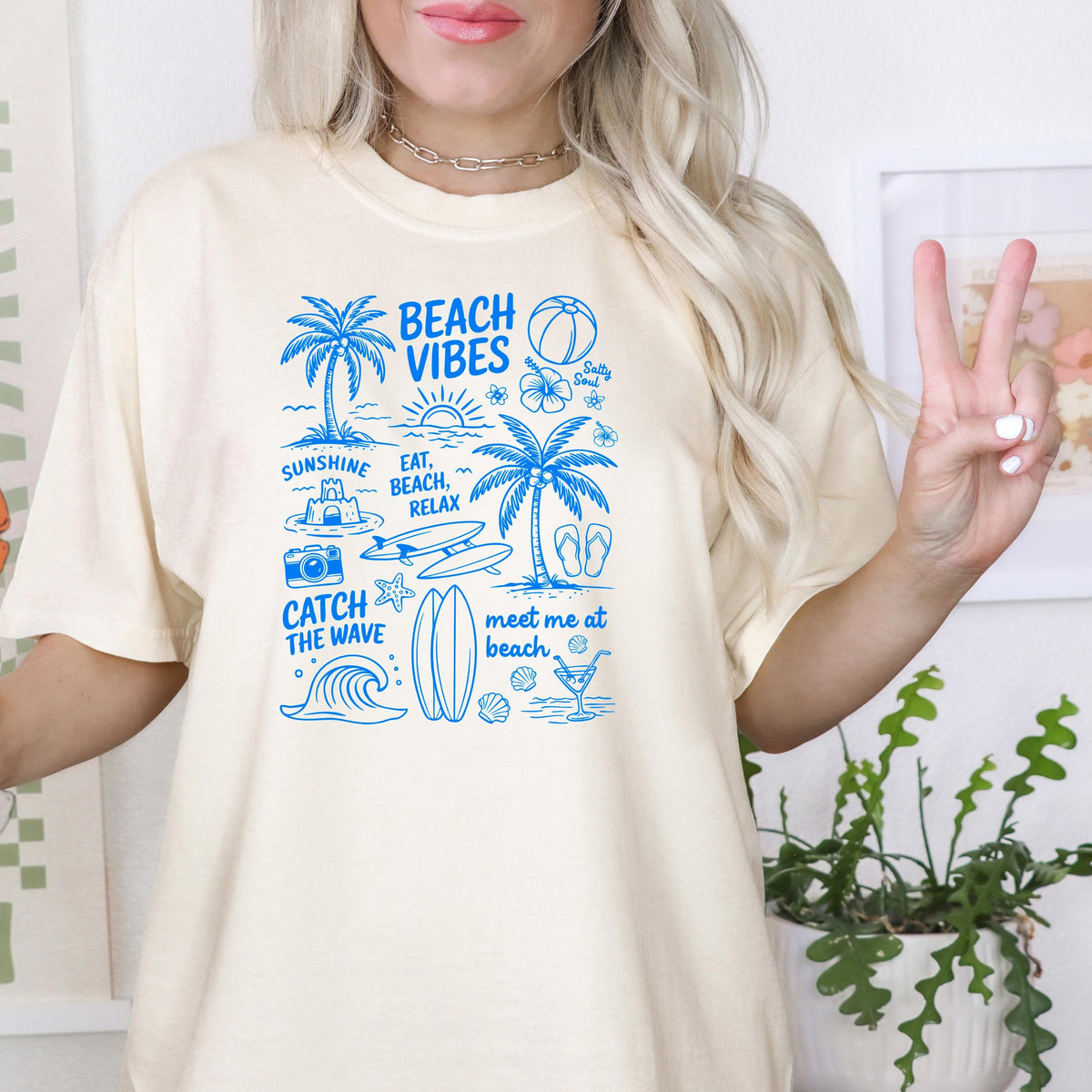 Ivory women’s oversized T-shirt with blue “Beach Vibes” front graphic