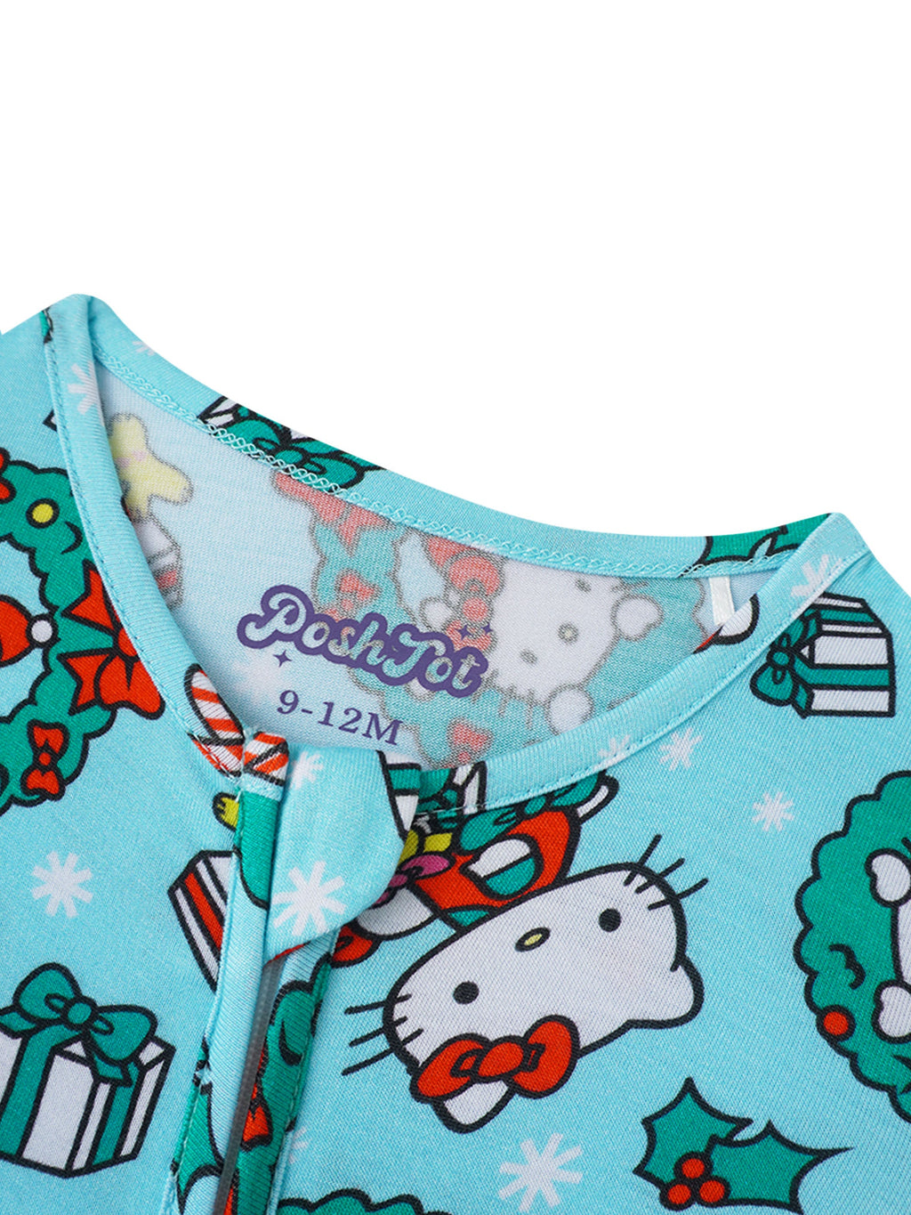 Baby romper neckline close-up in light blue with patterned trim and snap/zip placket
