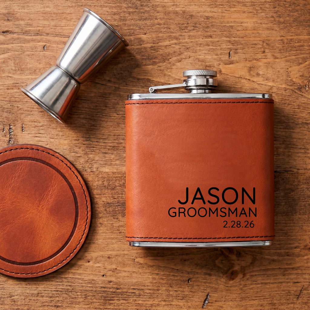 Stainless steel flask with brown leather sleeve and engraved JASON GROOMSMAN