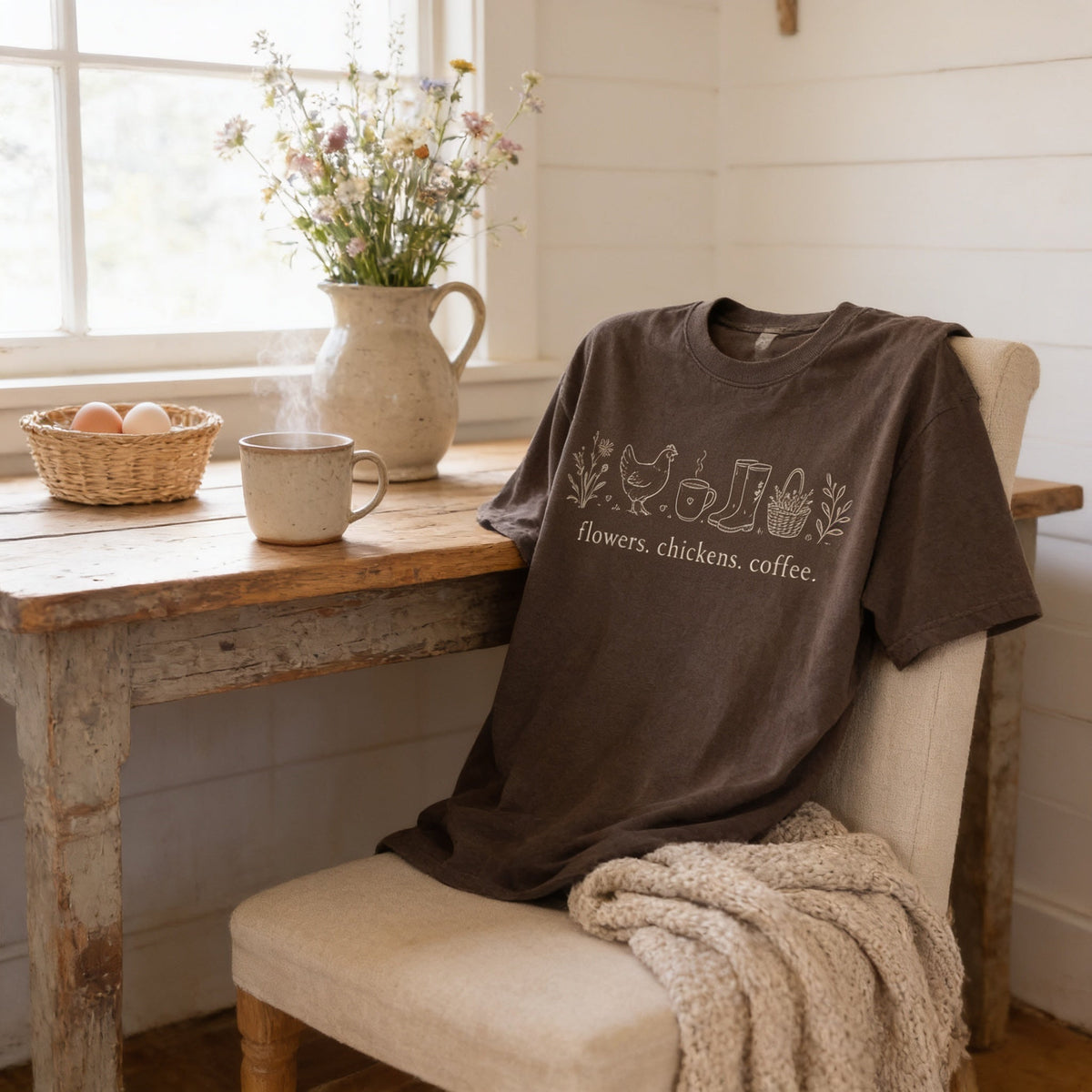 Brown unisex t-shirt with chicken, coffee, and flowers graphic on the chest