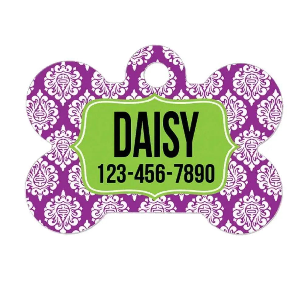 Purple damask dog bone tag with Daisy and phone number on green nameplate