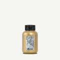 Davines More Inside texturizing dust bottle with golden liquid, black cap