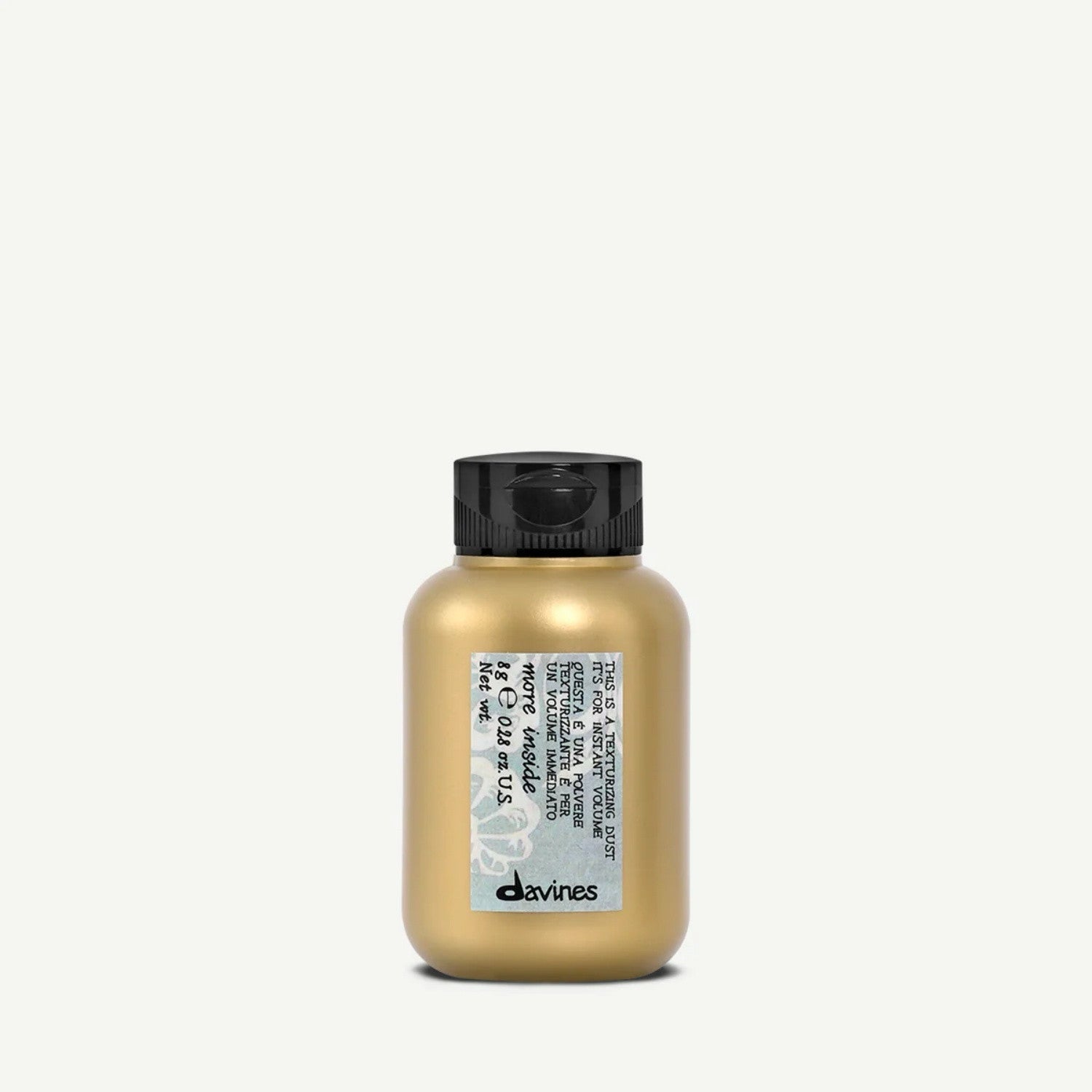 Davines More Inside texturizing dust bottle with golden liquid, black cap
