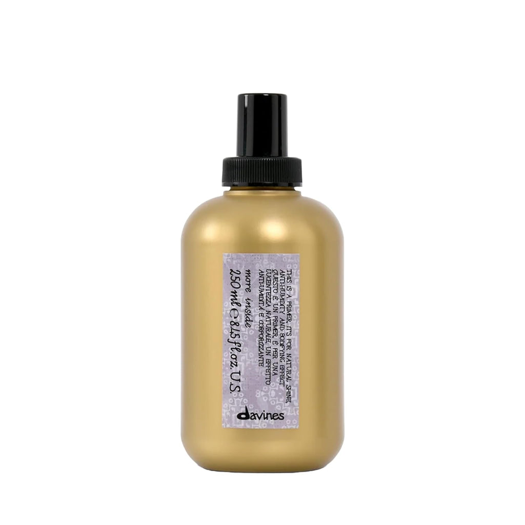 Golden bottle with black pump top, Davines blow dry primer
