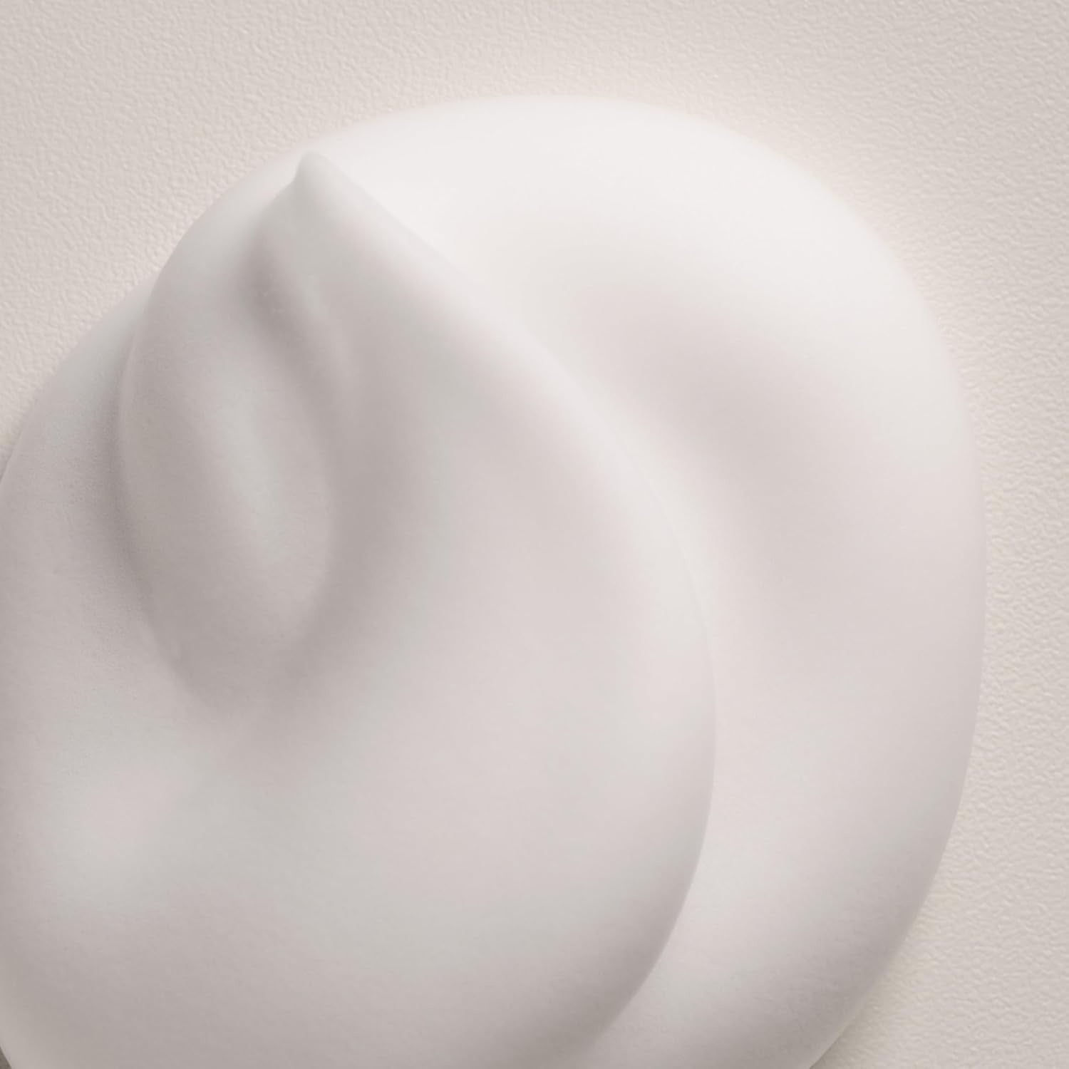 Curl moisturizing mousse foam texture in soft focus