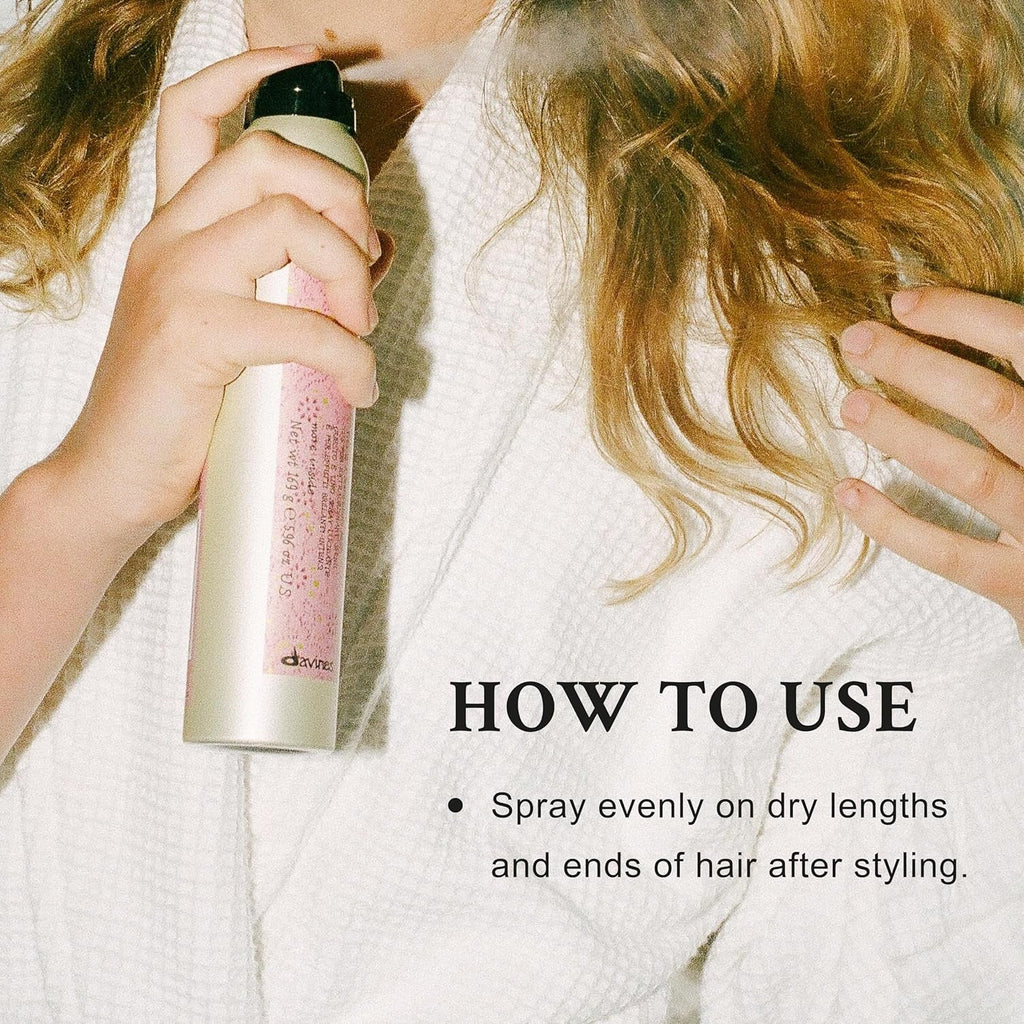 Davines shimmering mist spray bottle in white and pink with black cap