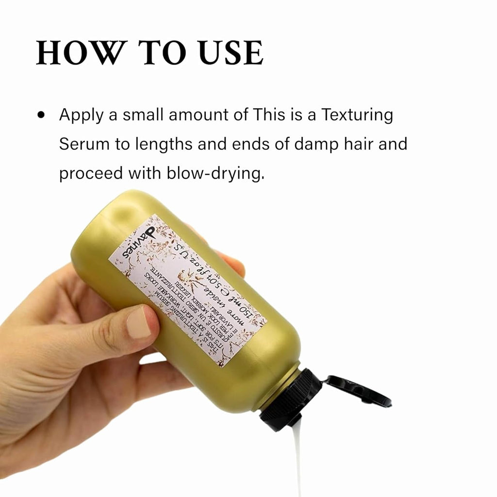 Texturizing serum bottle held in hand, beige with black cap and nozzle