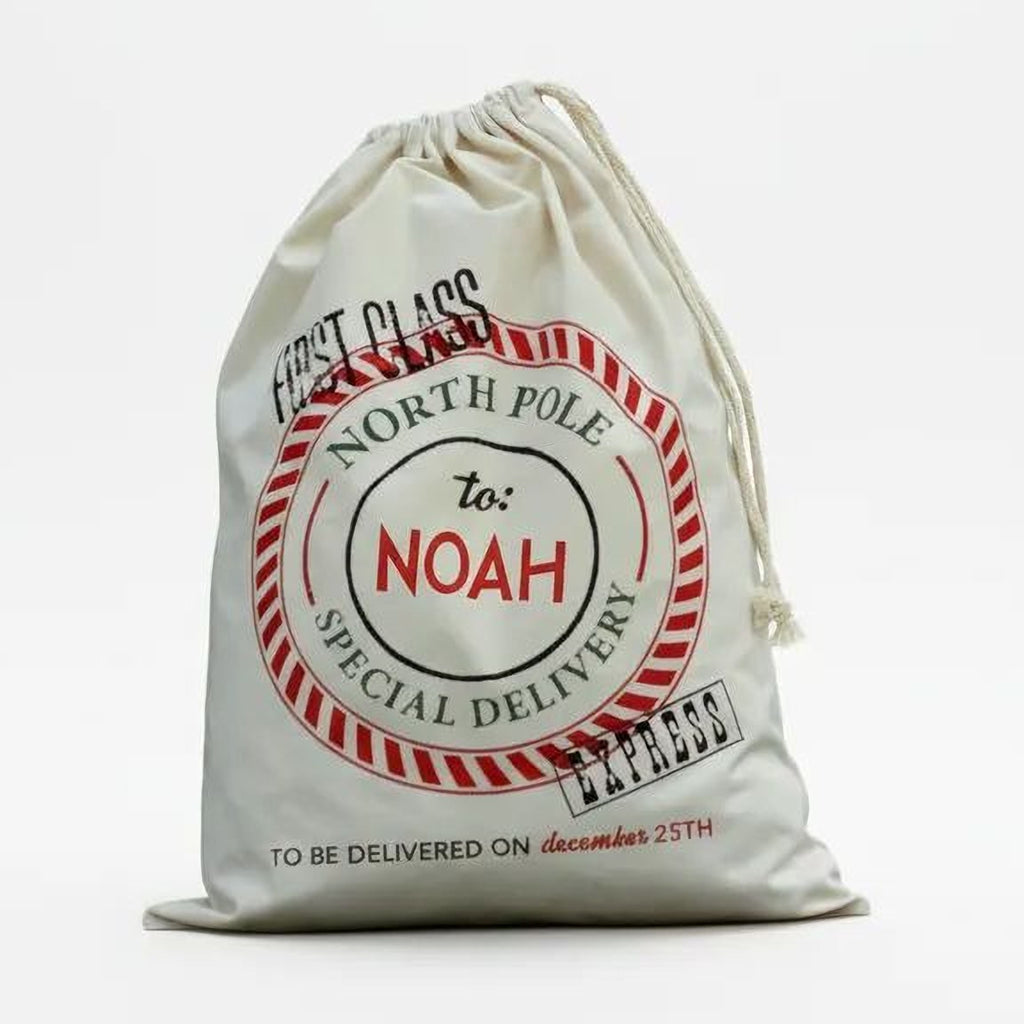Cream canvas Santa sack, red 'North Pole' seal with 'To: Noah', drawstring closure.
