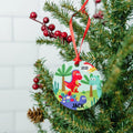 Dinosaur Christmas ornament with red ribbon, '2021' and 'JACK' on round design