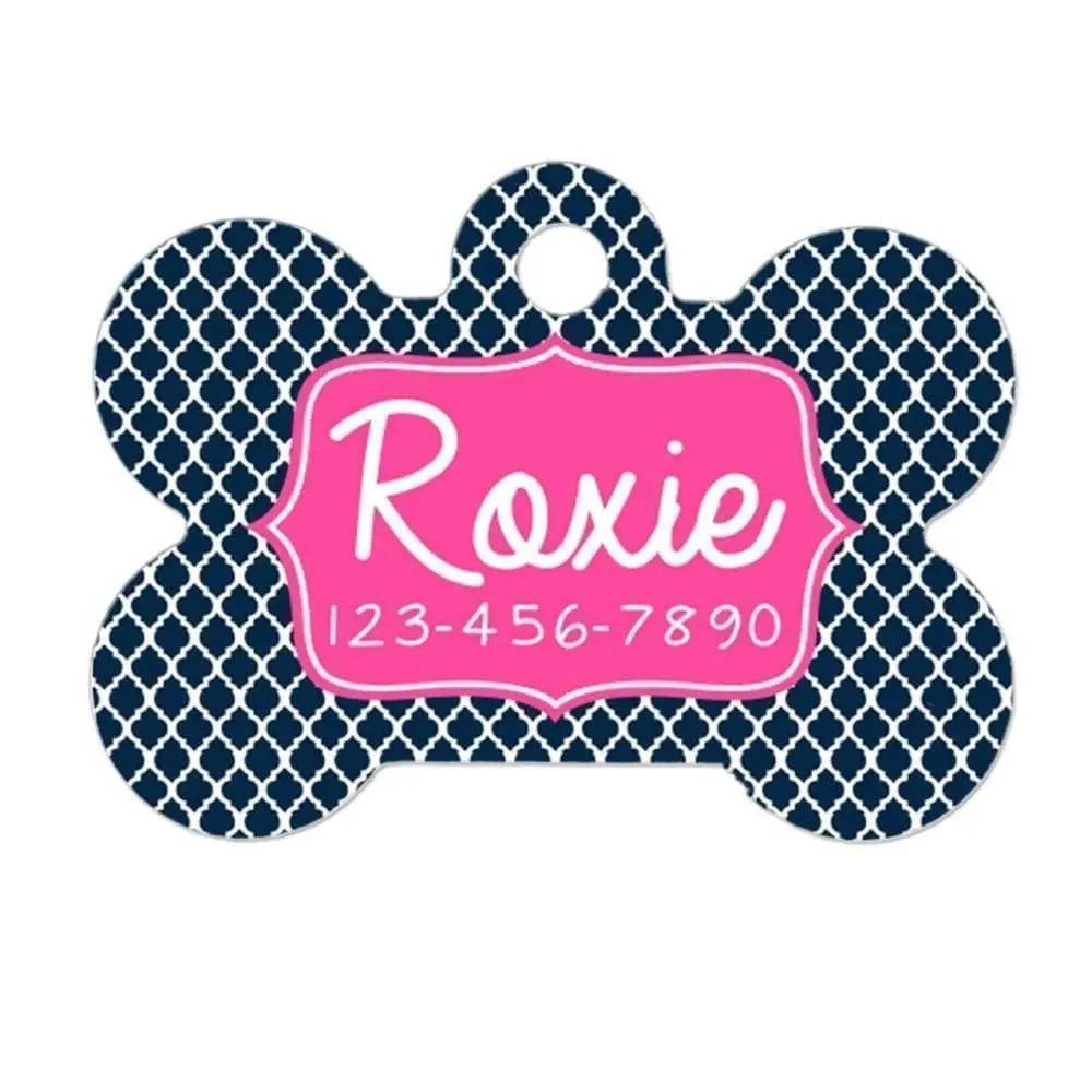 Personalized dog collar tag with navy quatrefoil and pink name tag reading Roxie