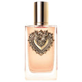 Perfume bottle with gold cap and pink liquid, ornate heart logo on label