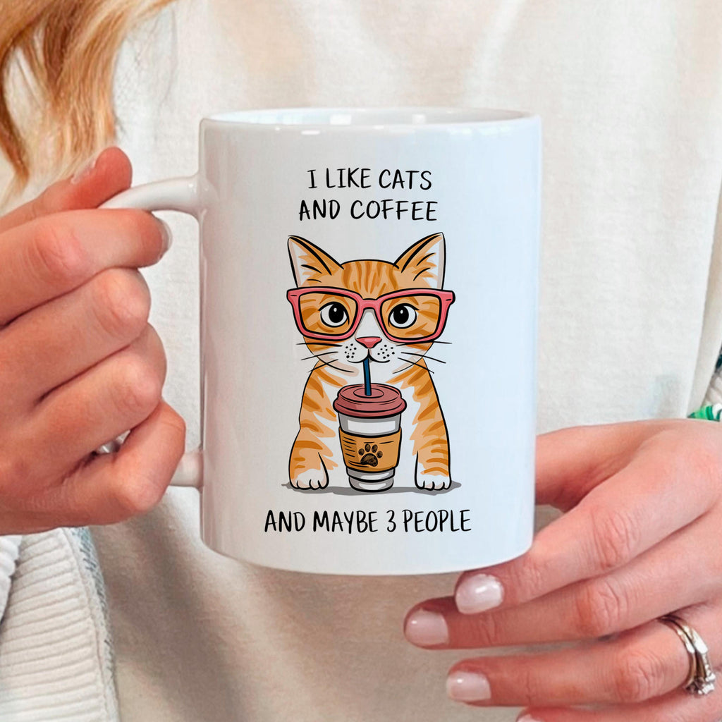 Ceramic cat coffee mug with orange tabby cat graphic and text 'I like cats and coffee'