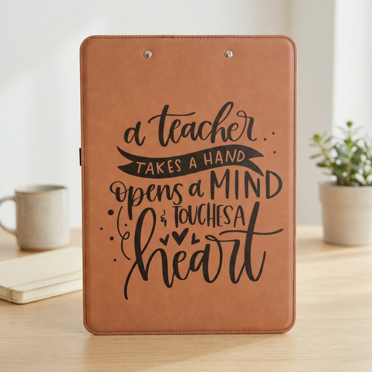 Rawhide brown leather clipboard with teacher quote design and metal clip hardware