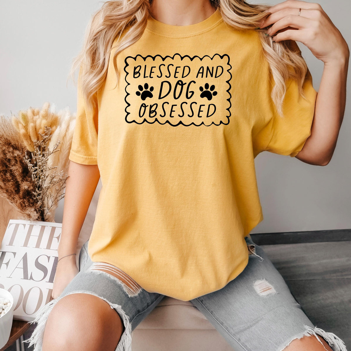 Mustard yellow short-sleeve T-shirt with “Blessed and Dog Obsessed” paw print graphic