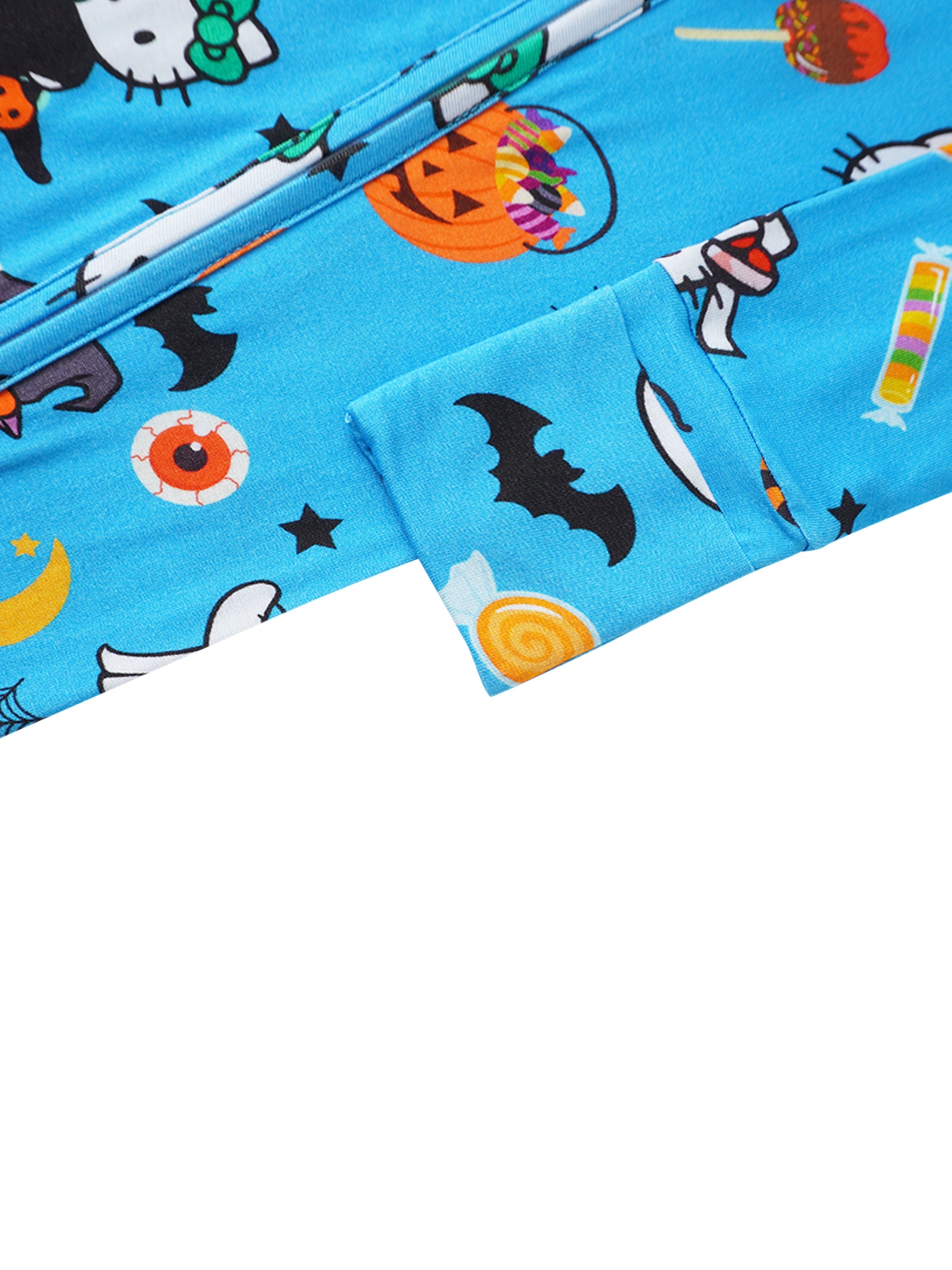 Blue bamboo romper leg with colorful Halloween print near zipper placket