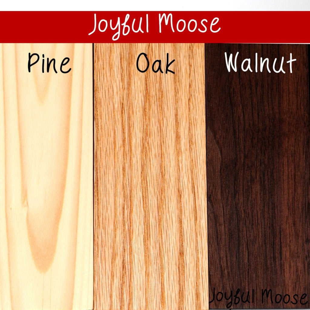 Wood samples for sign options: Pine, Oak, and Walnut