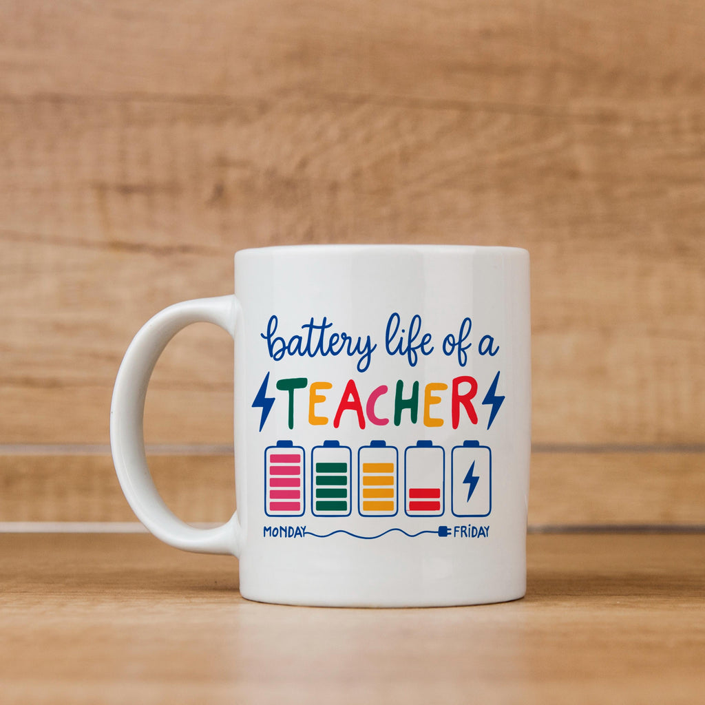 White ceramic mug with “battery life of a TEACHER” battery graphic and handle