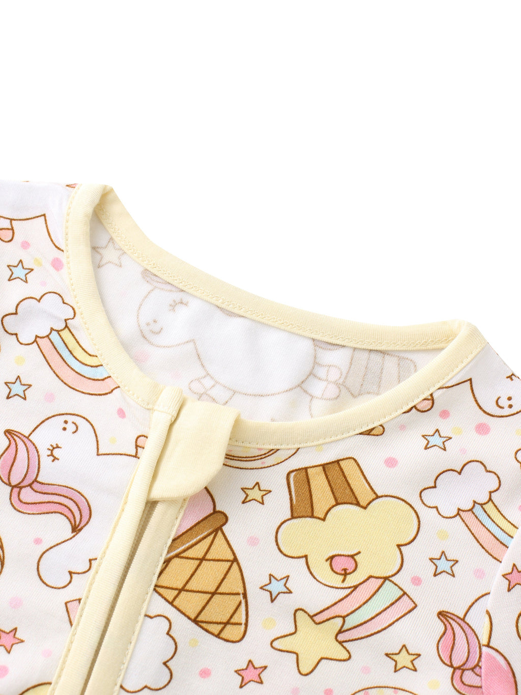 Baby romper neckline and front placket with rainbow snacks print and cream trim