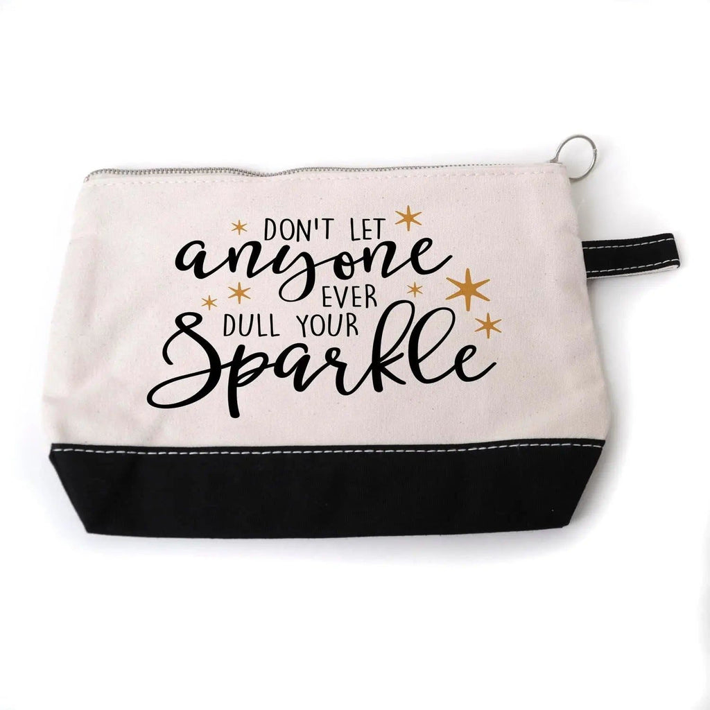 Beige canvas zippered pouch with black bottom, zipper pull, and full 'anyone ... Sparkle' text.