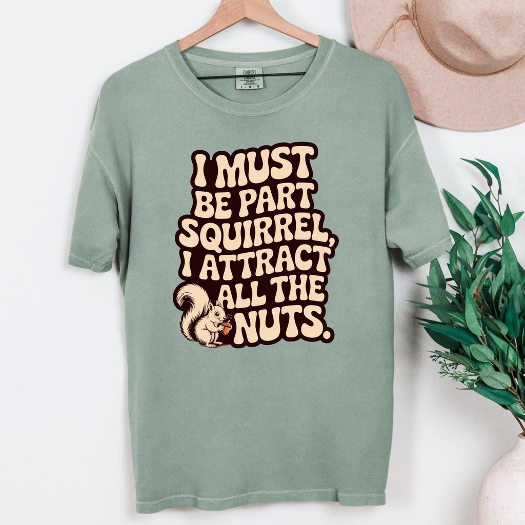 Moss green T-shirt with squirrel quote graphic printed at the center front