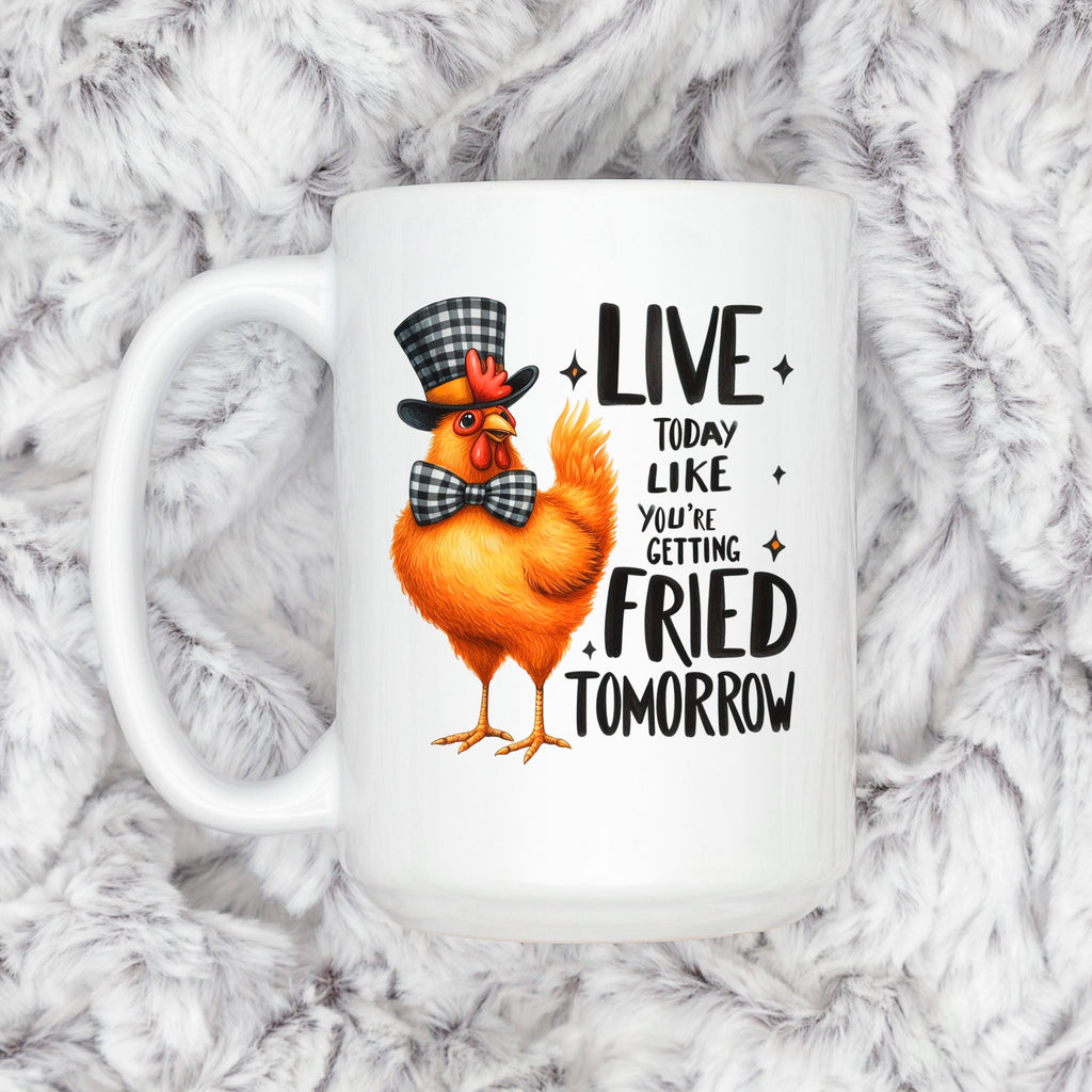 White ceramic mug with orange cartoon chicken and LIVE…FRIED TOMORROW text, front view